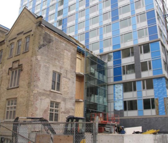 Colonial Building Restoration finishing exterior job at Toronto YWCA