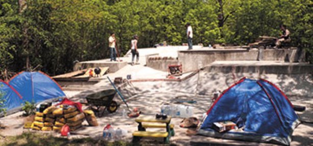 The concrete grind of a skateboard park build