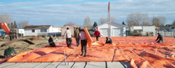 ICS Group workers protect concrete slab in Taber, Alberta
