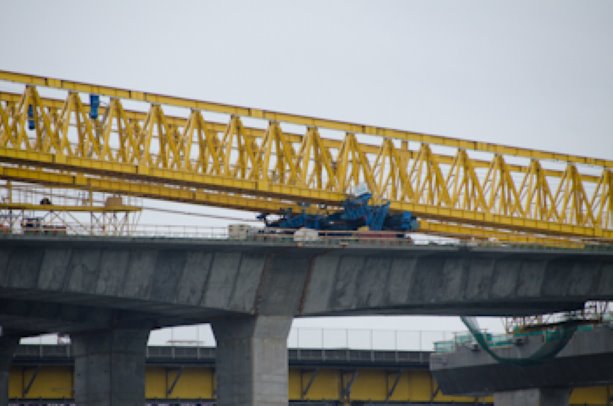 Pre-cast concrete segment falls into river after gantry crane collapses