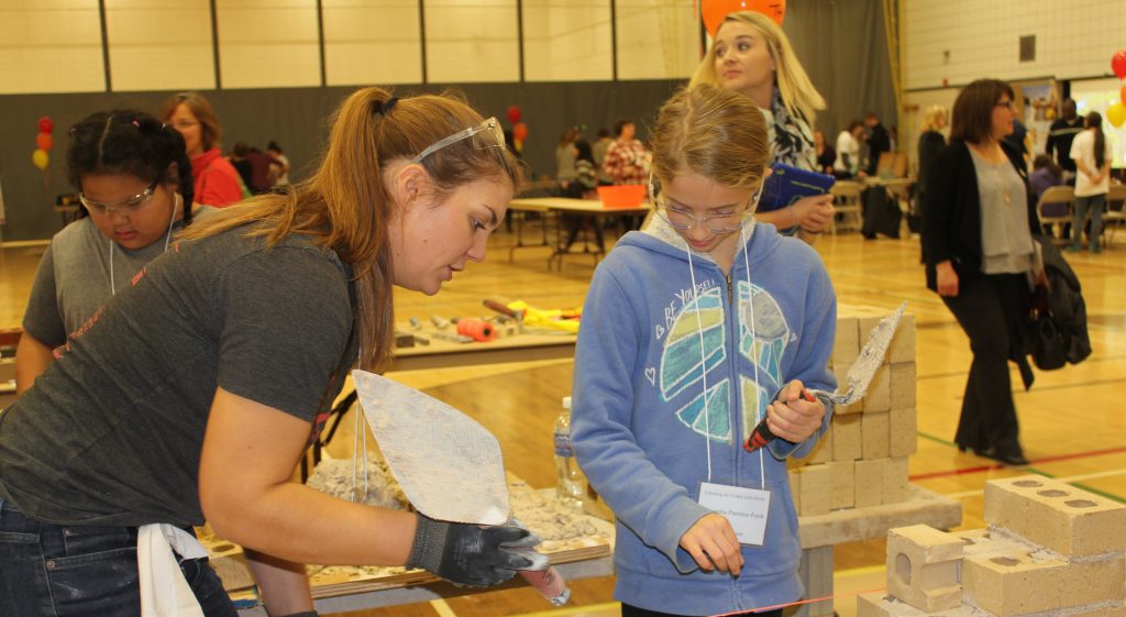 Girls can test out the trades by Unlocking the Toolkit