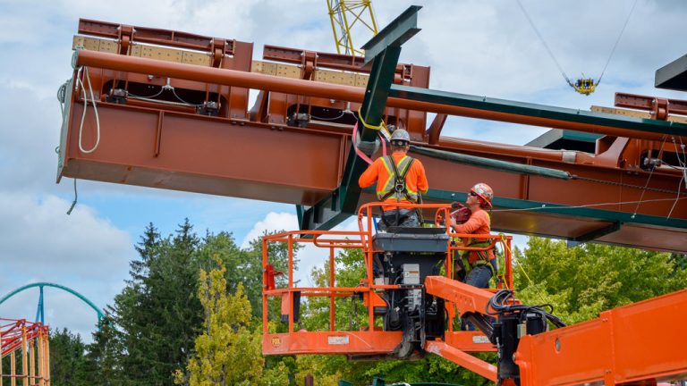 Crews on the Yukon Striker construction site at Canada’s Wonderland in Vaughan, Ont. work to erect the first lift section of the coaster. The heavy steel pieces of the coaster require significant rigging and are lifted into place with cranes.