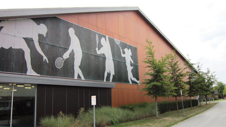 Design-build can result in pre-engineered metal buildings that can accommodate architectural features and shapes as shown with the UBC Tennis Centre built by the Permasteel Group of companies.