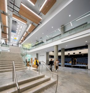 An atrium cuts through the centre of the new Emily Carr University bringing natural light into the building. The atrium floors are broken up by the installation of horizontal fire shutters.
