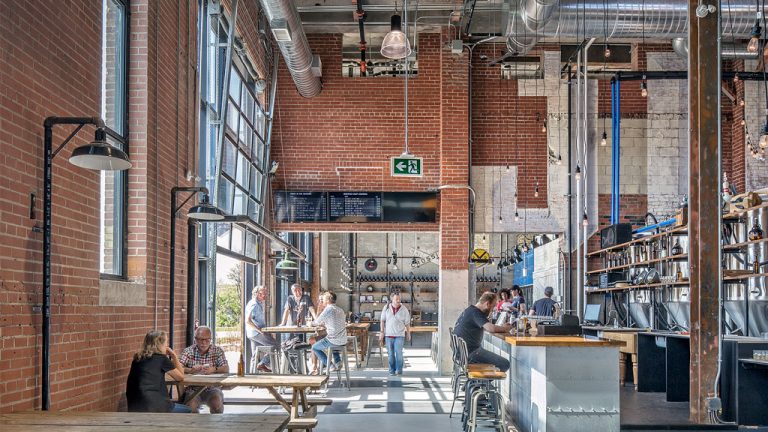 Junction Craft Brewing is now housed in a renovated industrial building in the Stockyards district of Toronto’s west end. The company’s 1,358-square-metre facility at 150 Symes Road contains a brewery, taproom, retail space and office space. The brewery project recently won an adaptive reuse award.