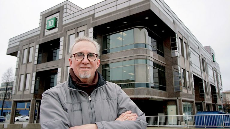 Filmmaker Dwight Storring, who produced, directed and edited the documentary film Finding John Lingwood about one of Waterloo Region’s leading mid-century architects, stands in front of one of the last buildings Lingwood designed, the TD Bank at the corner of King and Francis streets in downtown Kitchener. The film premiered Jan. 17 in Waterloo, Ont.