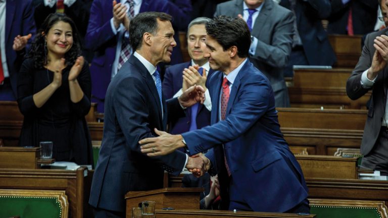 Federal Finance Minister Bill Morneau shakes hands with Prime Minister Justin Trudeau after unveiling the 2019 federal budget. One of the main items of the budget included a one-time $2.2-billion top-up to the federal Gas Tax Fund supporting municipal infrastructure.