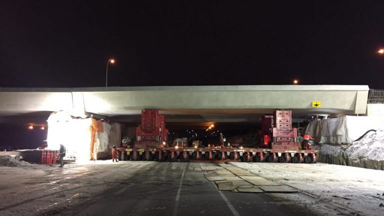 Crews use a multi-axle mobile platform to lift a span for the Whitemud LRT Bridge. The bridge is part of Edmonton’s new Valley Line LRT project expected to be operational in 2020.