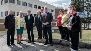 Government and hospital officials stand in front of G.R. Baker Memorial Hospital in Quesnel, B.C. The hospital announced it will receive $27 million for upgrades to its emergency department and intensive care unit.