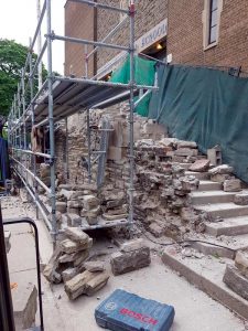 BRC Restoration’s restoration on Toronto’s Central Technical School includes work on the school’s stairways which, after 70 years, are tipping out and shifting away from the school wall. There are failed mortar joints ,stone displacement and structural cracks. Masons are tagging and cataloguing all of the stones to make sure they can be returned to their original location. Each of the 1,000 stones have received their own ID number.