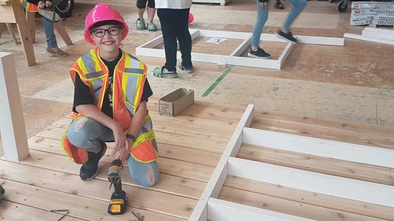 Attendees at Thompson Rivers University’s Carpentry Camp For Girls in B.C. build a playhouse.
