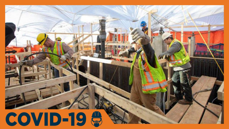 Workers at the Site C project in Fort St. John, B.C. place a concrete slab. Project officials announced March 18 that they would be reducing the number of workers on the site in response to the COVID-19 pandemic.