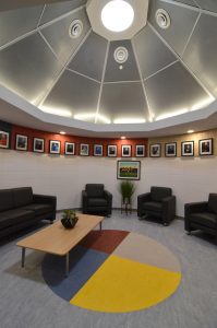 Chief Sabitawasis school, designed by architect Heney Klypak to double as a community activity centre in the evenings, features an elders' room. The use of masonry in the structure permitted a circular room design while masonry also provides an effect thermal mass and sound barrier.