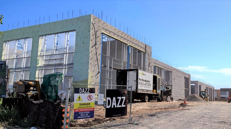 Despite a dramatic loss in April, Statistics Canada reported that ICI investment in the January-May period in Ontario was almost exactly the same as the same period in 2019. The Ontario Construction Secretariat analyzed the data in July. Pictured: an office-industrial complex from Dazz Group underway on King Road in Burlington, Ont.