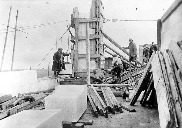 Crews work on the Figure of Canada, one of the many carvings included in the Canadian National Vimy Memorial. The limestone block used for the figure was the largest single block used on the project.