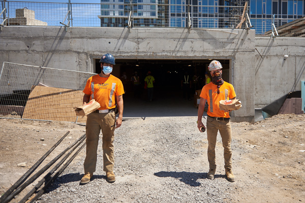 In July, RioCan showed its appreciation for the efforts of its workers soldiering on during the pandemic by buying lunch delivered to nine sites across Canada. Pictured, workers at Ottawa’s Frontier project took a break with lunch prepared by a local restaurant.