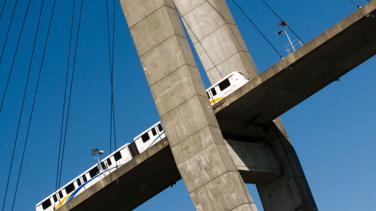 A SkyTrain car zips over the Fraser River from New Westminster to Surrey, B.C. City officials in Surrey celebrated federal funding commitments announced this month which could help extend the SkyTrain system further east into Langley.