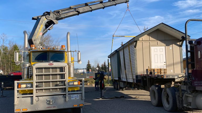 A bunkhouse for Scouts Canada is lifted into place near Prince George, B.C.