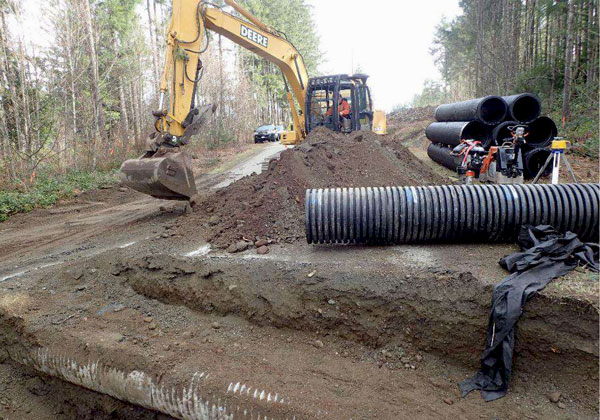 Two excavators were brought in to prepare the embankments and areas for installation of the culverts and fencing. Crews spent roughly three weeks grading the embankments. They had to break up asphalt on the road and dig trenches for the culverts. Crews spent two days laying the culverts themselves for the toads.