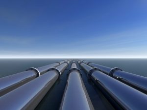A digital rendering of 5 pipelines going off into the horizon over water.