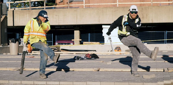 Gino’s Gerussi’s video has captivated audiences as funny and light-hearted. It features him singing and dancing with several construction crew members joining in with high-stepping, chorus-line kicks.