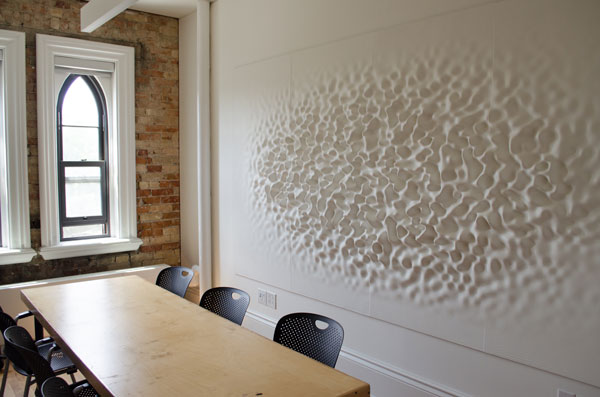 Pictured is a meeting room with an acoustical diffuser.