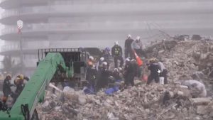 Demolition widens search at Florida condo site, but storms threaten