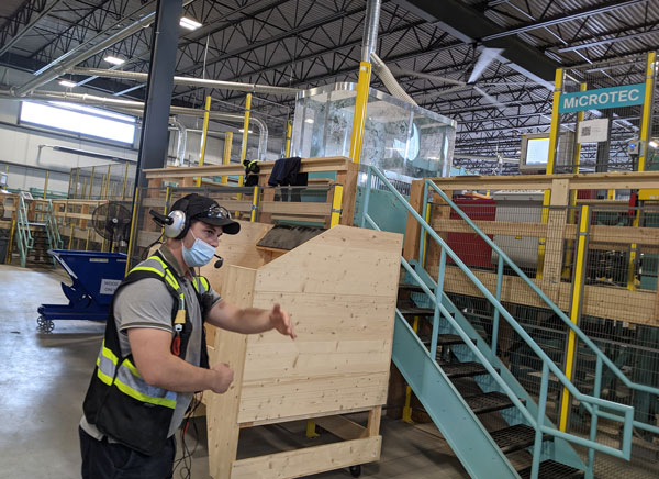 Element5 wood specialist Seth Norris conducted a tour of the firm’s new St. Thomas plant Aug. 17.