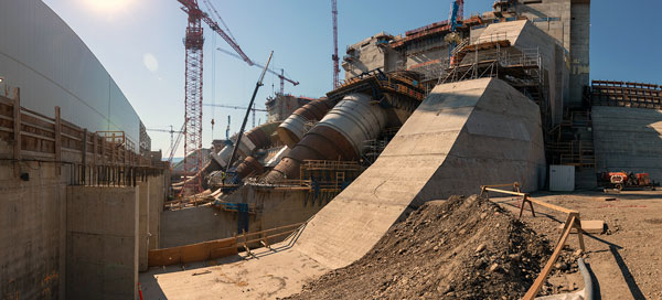 Pictured is an east-facing view of five of six penstock units in varying stages of construction at the Site C project.