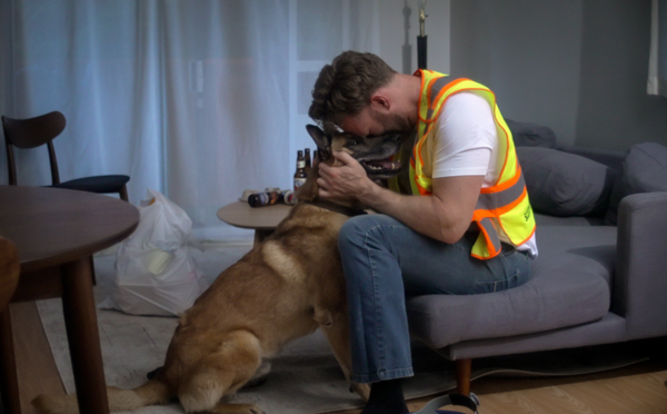 After work the lead character Dave in the Lone Hunter video returns to a darkened apartment and eats takeout in front of the TV, his only companion his faithful dog Marley.