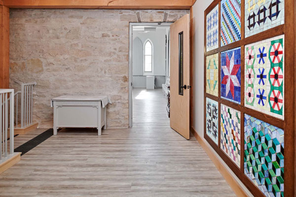 A historical and cultural landmark of Guelph’s Essex-Nottingham neighbourhood, Heritage Hall (architect William Slater, 1880; addition by Joel Bartlett Architect Inc.) has been serving its community for more than 130 years, providing a space for celebration and gathering, all while preserving Southwestern Ontario’s Black heritage. This photo shows inside the newly accessible entrance to Heritage Hall.