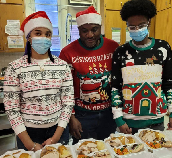 IUPAT rep Ivan Dawns (centre) spearheaded an effort to serve 250 Christmas meals at the Back Door Mission on Simcoe Street in Oshawa, Ont. on Christmas Day.