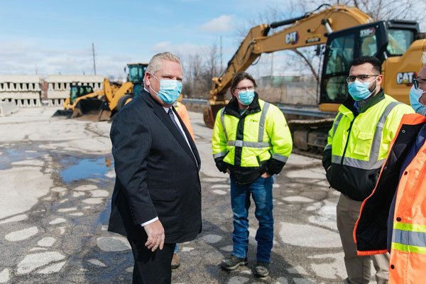 BuildForce says heavy public spending on infrastructure will help sustain the province’s construction economy over the next six years. Pictured, Ontario Premier Doug Ford announced an expansion of the province’s highways and transit plans on March 10.