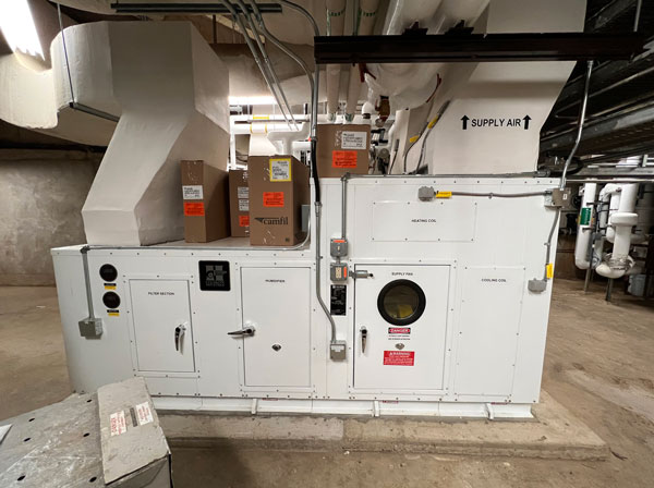 This air-handling unit at the University of Guelph was redesigned and built by Dean Lane Contractors, a member contractor of the Mechanical Contractors Association of Kitchener-Waterloo. The unit heats and cools parts of three student residence buildings and pumps up to 100 per cent fresh air into the common spaces of the residences.