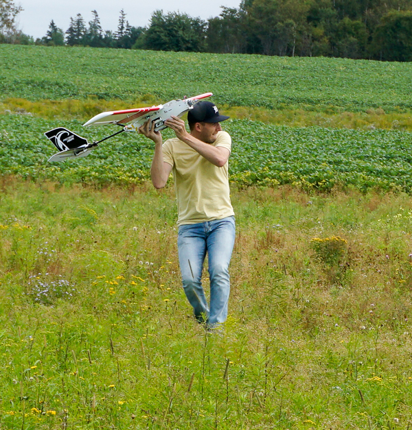 Derek Ellis launching the precision hawk drone.