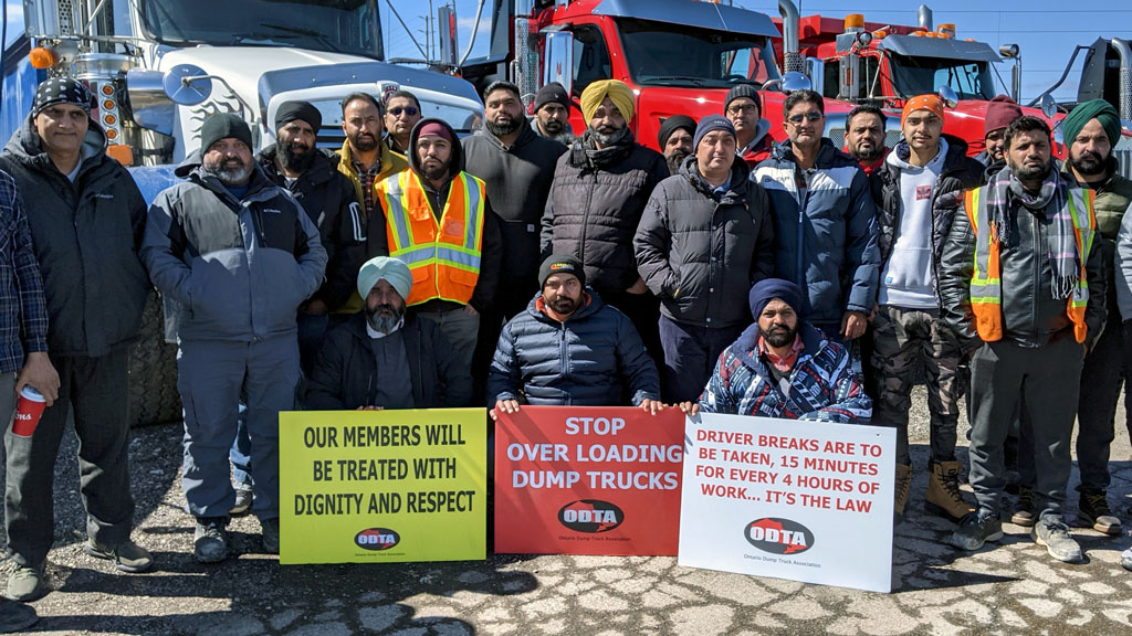 Protesting dump truck operators demand higher fees, more respect