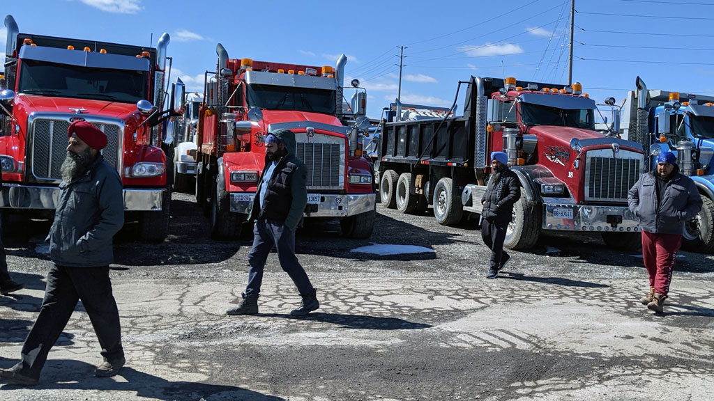 Dump truck job action extends to third week