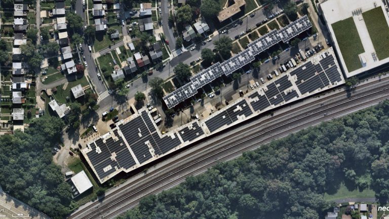 An aerial image shows the completed roof of one of the largest commercial solar installations in Washington, D.C., an 842-kilowatt system that can power 150 homes annually and is located in Brookland.