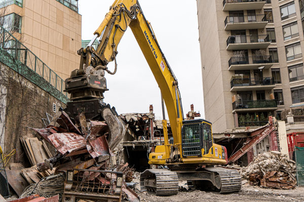 Rubble and debris from the previously demolished floors of the hotel was cleaned up before jackhammering the next level. Once the demolition had reached the lower levels, larger machines were used.