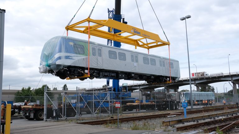 A SkyTrain car is unloaded onto the track in Metro Vancouver. Officials are asking the public for input on plans to extend the SkyTrain system out to Langley.