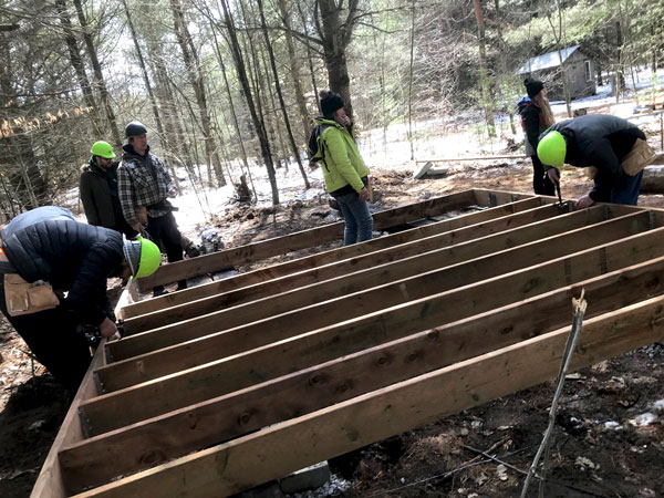 Students are spending three days a week from 9 a.m. to 4 p.m. at the farm in the middle of the woods constructing the 14-by-24 sleeping cabin. The cabin was designed by the faculty at George Brown College to reflect the hands on skills required to complete the course, including building a deck on the front of the structure.