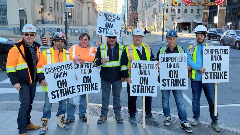 Pictured are Carpenters’ Union Local 27 members picketing at 141 Bay St. in Toronto. They have been on strike since.