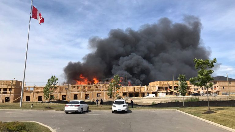 A massive fire broke out at a housing development near Rymal Road and Upper Red Hill Valley Parkway in Hamilton just before 4 p.m. Monday, July 11.