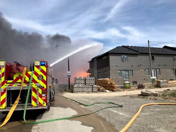 Hamilton’s fire chief reported 23 units in various stages of construction were completely consumed by the blaze.