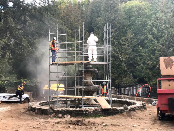 Clifford Restoration sets up scaffolding to carefully clean the fountain stonework and complete concrete repairs to the historic structure.