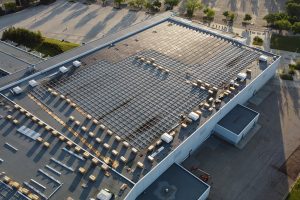 A drone shot captures a new solar array installed on the Edmonton Expo Centre, part of a $98 million rehabilitation project for the aging facility.