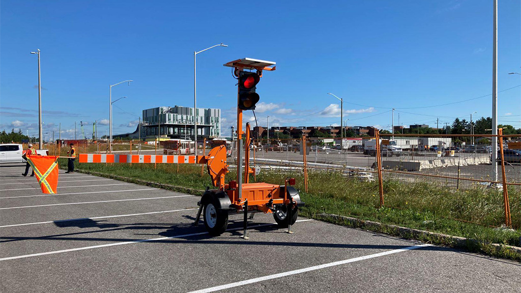 Automated Flagger Assistance Device being used on rural roads in Ottawa
