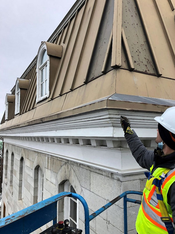 Pictured is RJC Engineers completing a detailed condition assessment of the building envelope and masonry structure.