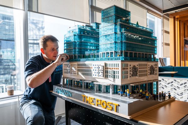 LEGO Master Builder Graeme Dymond puts the final touches on his model of The Post, Amazon’s currently under construction (in the real world) Vancouver headquarters.