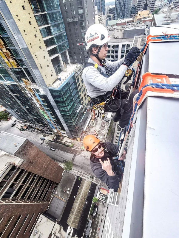 Members of Atwill-Morin’s rope technician crew on the job in downtown Montreal. The firm ensures that its team members can work together with special trust.